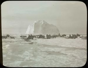 Image of Dog Teams Near Iceberg